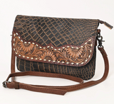 The Duskline Embossed Crossbody Purse in a white back drop.