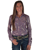Woman wearing a patterned long-sleeve shirt and jeans on a white background