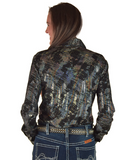 Woman wearing a patterned shirt and jeans on a white background