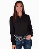 Woman wearing a black shirt and blue jeans with a studded belt on a white background