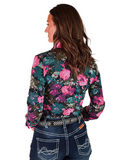 Woman wearing a floral patterned shirt with a white background