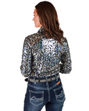 Woman wearing a patterned long-sleeve shirt and jeans on a white background