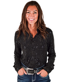 Woman wearing a black sequin shirt with blue jeans on a white background