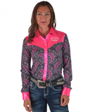Woman wearing a patterned shirt with pink accents and jeans on a white background