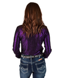 Person wearing a purple glitter top and blue jeans on a white background