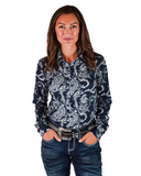Woman wearing a navy paisley print shirt standing in front of a white background.