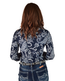 Woman wearing a navy paisley print shirt standing in front of a white background.