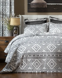 Ceniza Southwestern Comforter Set displayed in bedroom setting.