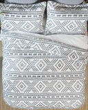 Ceniza Southwestern Comforter Set displayed in bedroom setting.