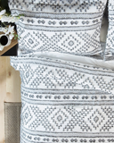 Pattern of Ceniza Southwestern Comforter Set displayed in bedroom setting.