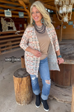 Acoma Aztec Duster styled and modeled by a women in western setting.
