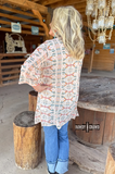 Acoma Aztec Duster styled and modeled by a women in western setting.