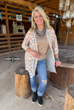 Acoma Aztec Duster styled and modeled by a women in western setting.