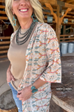 Acoma Aztec Duster styled and modeled by a women in western setting.