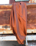 The Wynonna Wild Rag in Dark Coffee draped across the back hatch of an old truck.