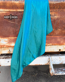 The Wynona Wild Rag in Turquoise draped over an old trucks back hatch. 