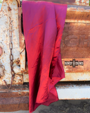 The Wynonna Wild Rag in Bula Burgundy draped over an old trucks back hatch.