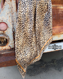 The Liberty Leopard Wild Rag draped over the back hatch of an old truck.