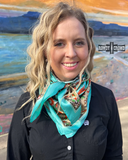 The Taos Valley Wild Rag tied onto a models neck with a picture of the desert behind her.