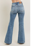 Steph High Waisted Trouser Flares being modeled on a women in front of white background.