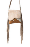 Crossbody bag with fringe and cowhide design on a white background