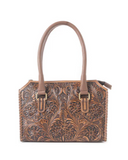 Brown leather handbag with intricate floral tooled design on a white background