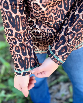 Hear Me Roar Leopard Pullover with Turquoise Zip by Sterling Kreek
