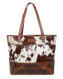 The Westin Hair on Hide Tote Bag in a white backdrop. 