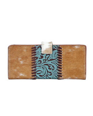 A western-style bifold wallet featuring tan and white cowhide panels, a turquoise paisley patterned center stripe, dark brown whipstitching, and a small white leather tab closure, shown against a plain white background.