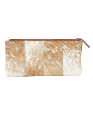 A horizontal zippered pouch featuring a patchwork design of cowhide panels in tan, brown, and white, with a light brown leather zipper pull, shown against a plain white background.