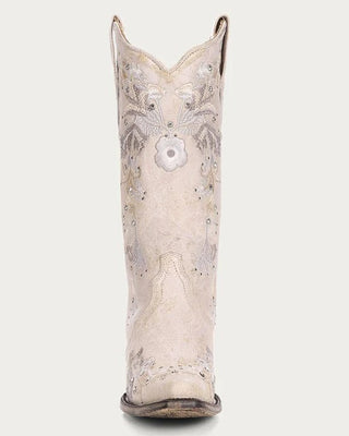 White cowboy boot with floral patterns on a white background