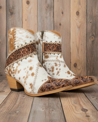 Cowboy boots with white and brown pattern on a white background