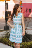 Woman modeling the Desert Skies Sleeveless Aztec Print Dress outside.