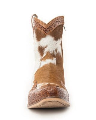 Brown and white cowhide cowboy boot on a white background