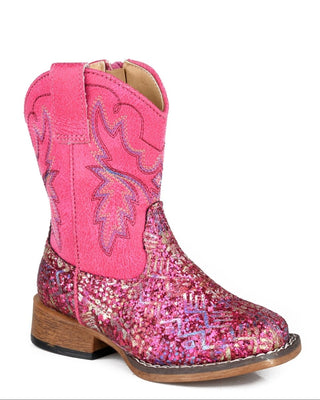 Glitter Aztec II Little Kids boot by Roper in fuchsia, showing a multicolor geometric glitter vamp, pink faux leather shaft and decorative western stitching