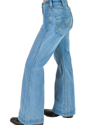 Light blue denim flare jeans shown from a side-back angle on a model, featuring a decorative embroidered wave pattern on the back pocket, paired with black shoes against a white background.