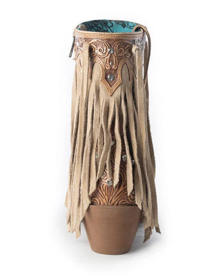 Decorative vase with fringe and intricate design on a white background
