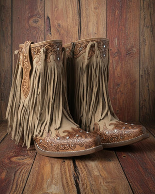 Pair of brown cowboy boots with fringe and intricate designs on a white background