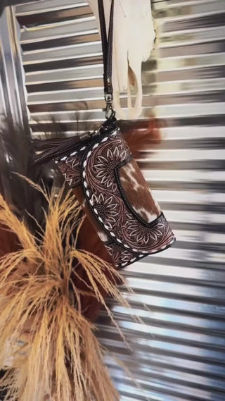 Your everyday wallet just got a serious upgrade. 🤎

The Sandstone Trail Wristlet is crafted with hand-tooled leather, real hide, and fringe that turns heads.

✔️ Durable, gorgeous, and functional
✔️ One-of-a-kind details (no two are alike)
✔️ Wristlet convenience, wallet practicality

Built to last. Made to show off.