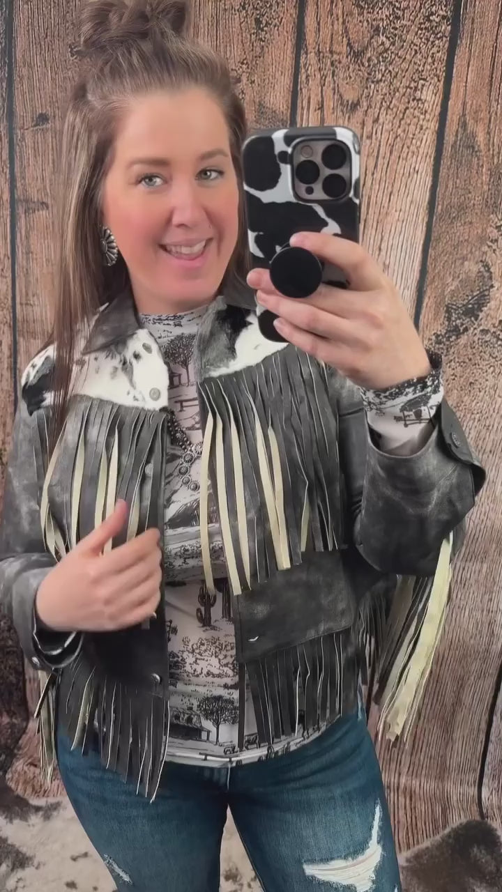 She’s bold. She’s badass. ⚡️🖤
The Midnight Rider Jacket is real leather, real fringe, and really hard to keep in stock. With vintage black distressing, cowhide detail, and buttery-soft fringe, it’s a total showstopper.

🔥 Premium leather feel
🔥 Statement-making fit
🔥 Only a few left in stock...

Throw it on and let the jacket do the talking.