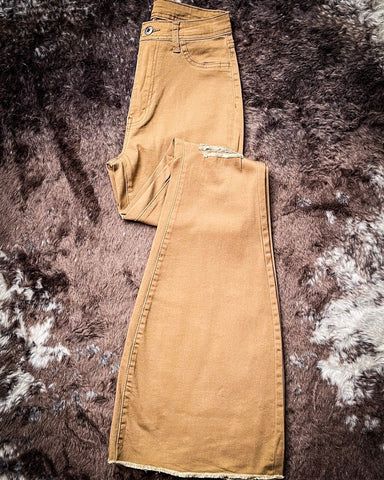 Front view of the Shannon Flare Jeans displayed on cowhide.
