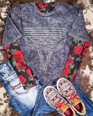 A little romance never hurt your outfit ❤️‍🔥

Our Rose of My Heart Mesh Top adds the prettiest pop of print to any look. Layer it under a graphic tee for a bold moment (like we did here), or wear it solo when you're feelin’ flirty. Stretchy, breathable, and way softer than you'd expect—this one’s all about drama without the discomfort.

Classic western rose vibes, but make it edgy 🌹🖤