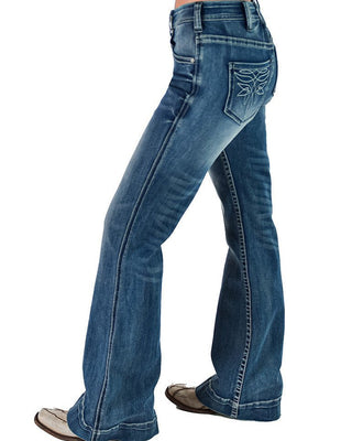 Blue jeans worn by a person on a white background
