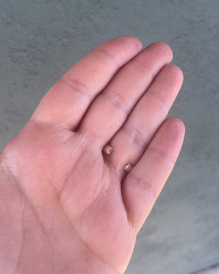 Adjustable ring back opening against a neutral background