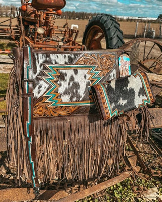 Bag with intricate design and fringes on a rustic background