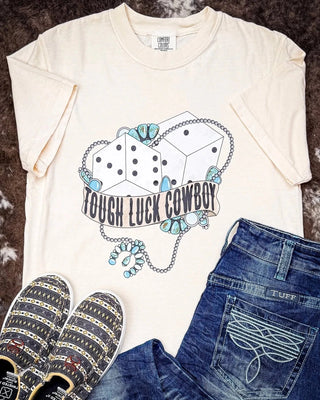 Feelin’ lucky? Or just dressin’ like it? 🎲

Either way, this Tough Luck Cowboy tee is comin' in hot with that soft, lived-in feel and just the right amount of sass.