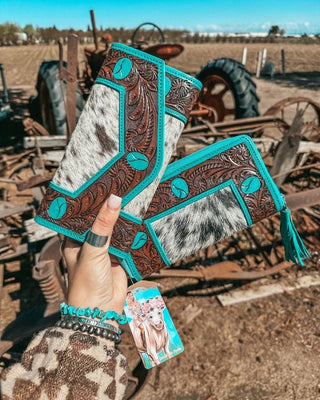 Wallet held by hand on rustic background.