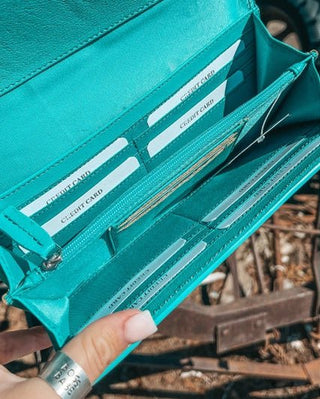 Wallet on rustic background.