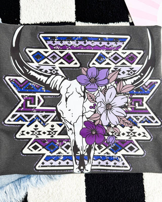 Gray t-shirt with a skull and floral design on a geometric pattern