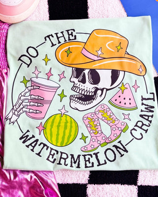T-shirt with a skeleton design, cowboy hat, boots, and watermelon on a colorful background.